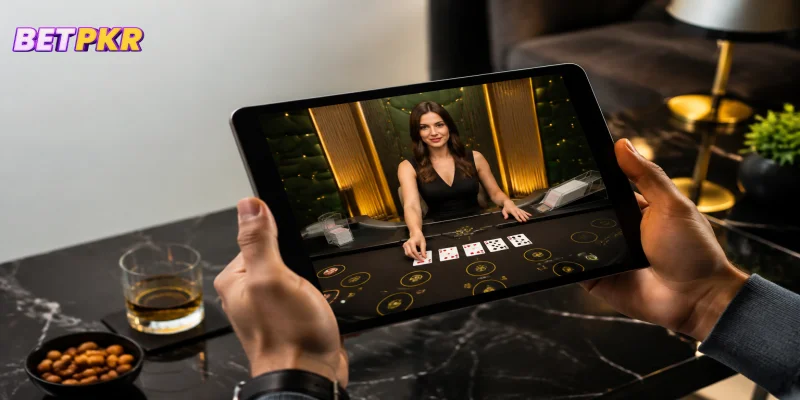 A live casino dealer table streaming in high-definition on a tablet screen.